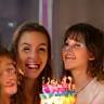 Family celebrating birthday with cake