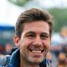 Man giving thumbs up at outdoor event