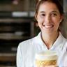 Woman at culinary class holding a dessert